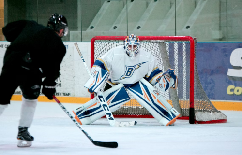 Screenshot-2025-10-26-at-14-43-25-Man-taking-aim-for-goal-on-hockey-goalie-photo-–-Free-Building-Image-on-Unsplash-e1761504449234.png